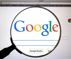 Magnifying glass over a Google search engine